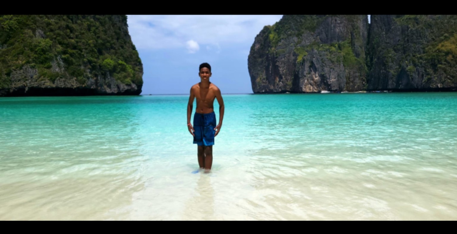 Chase standing in tropical blue water