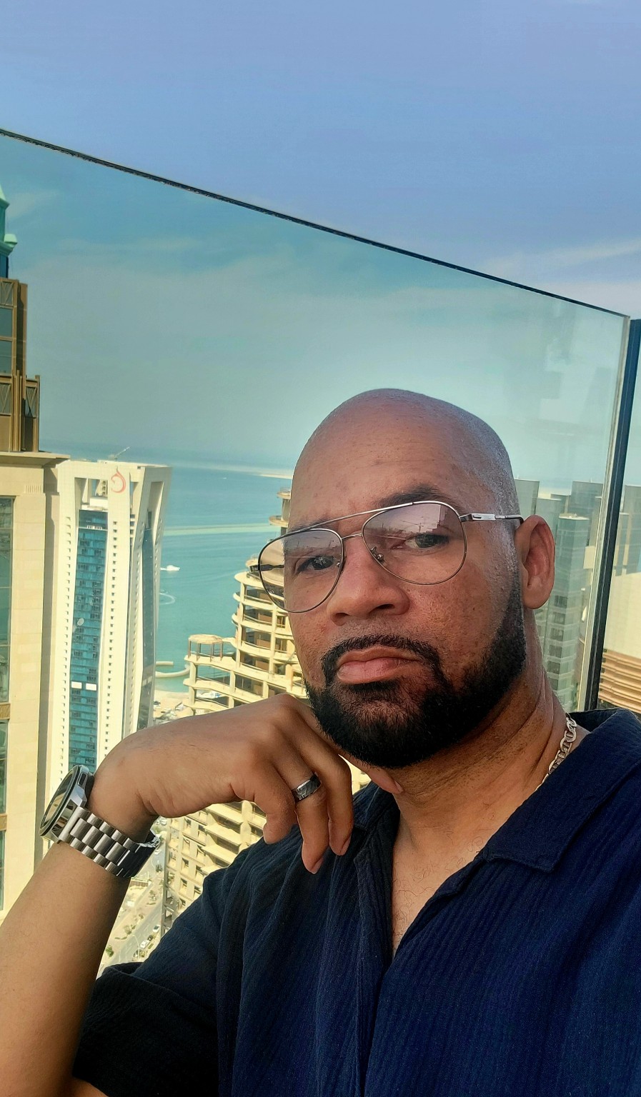 Jamel on a balcony overlooking Doha