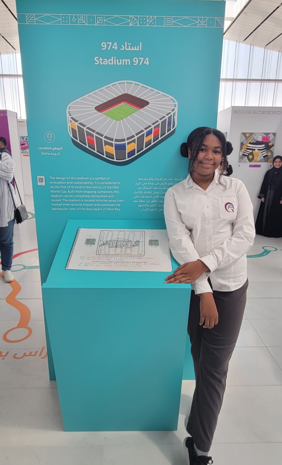 Kelsie with her Stadium 974 artwork display